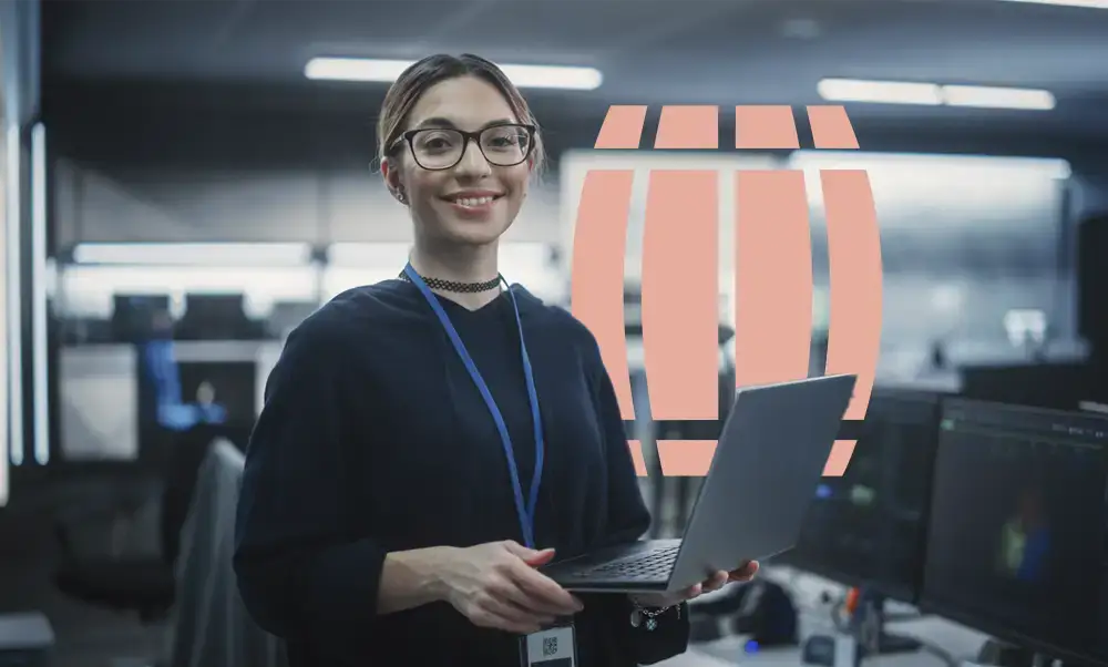 replatforming-1489414046 Woman Looking at Camera and Charmingly Smiling. Businesswoman at Work, Information Technology Manager, Software Engineering Professional