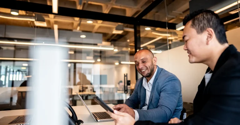 Coworkers talking during a meet at office